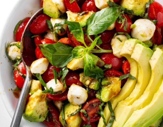 Avocado Caprese salad in a bowl.