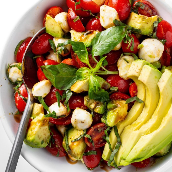 Avocado Caprese salad in a bowl.